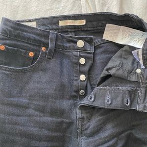 Black, boot cut Levi’s rib cage jeans